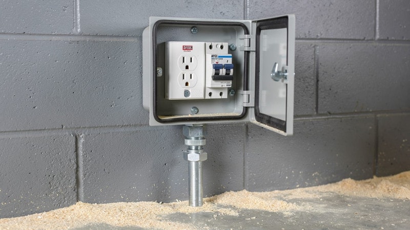 GFCI and AFCI safety devices in a farm building enclosure